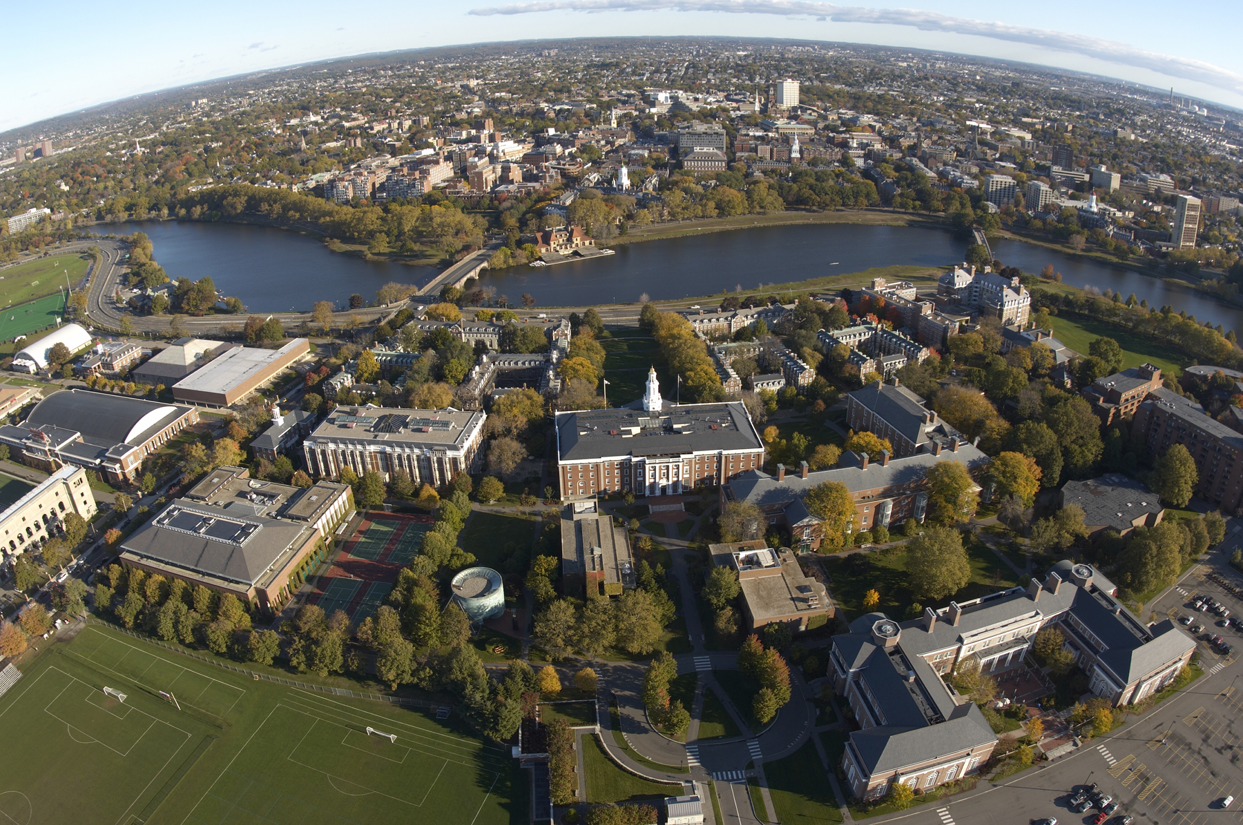 Aerial view of Harvard University campus along the Charles River representing the complete strategy guide for European and UK students applying to top US colleges, including Harvard, Yale, Princeton, MIT, and other elite institutions.