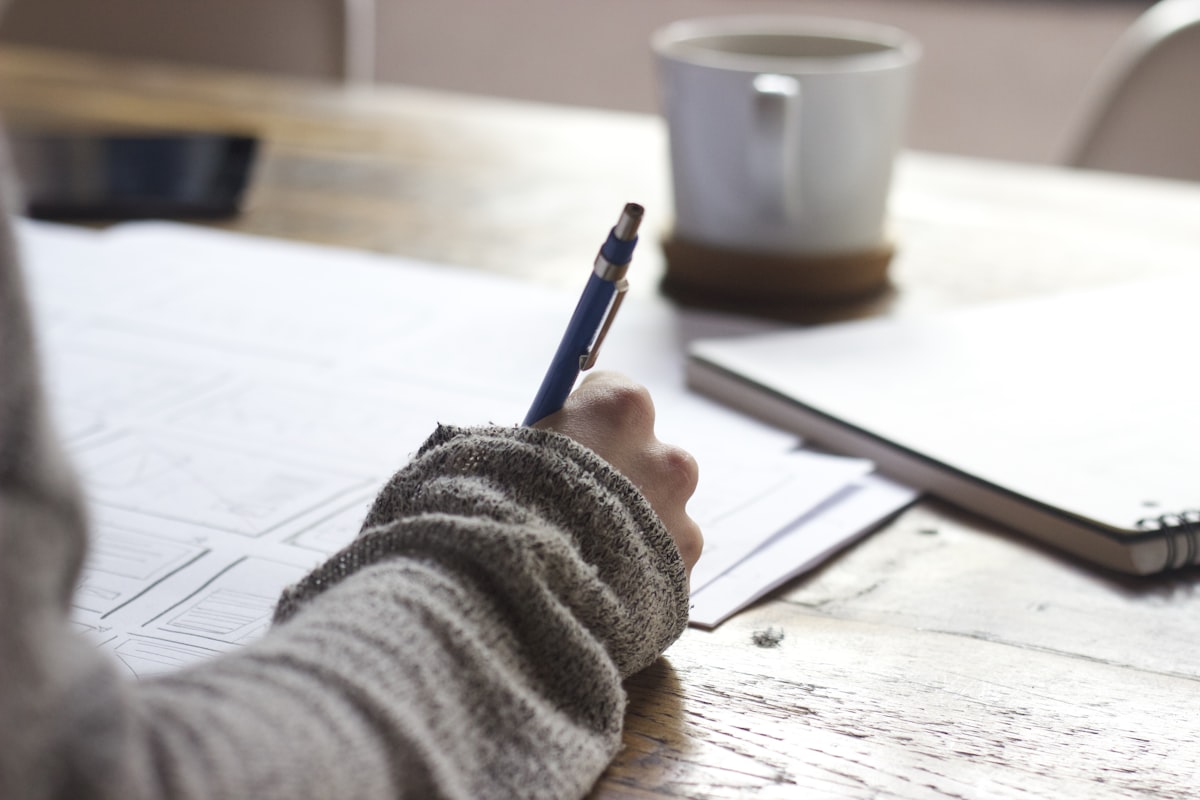 Student writing Common App activities list for college admissions 2026-2027