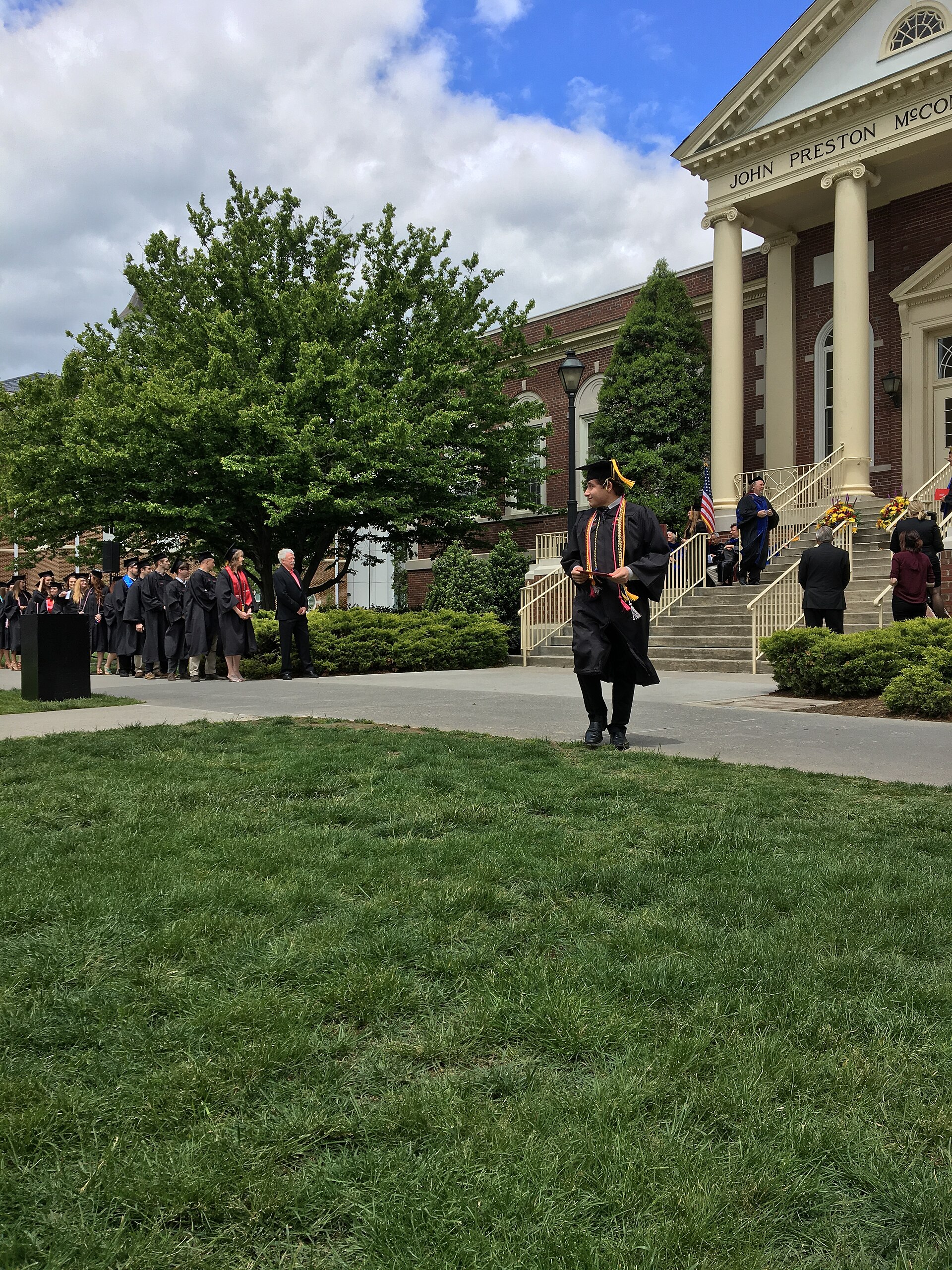 University graduation ceremony with graduates in caps and gowns