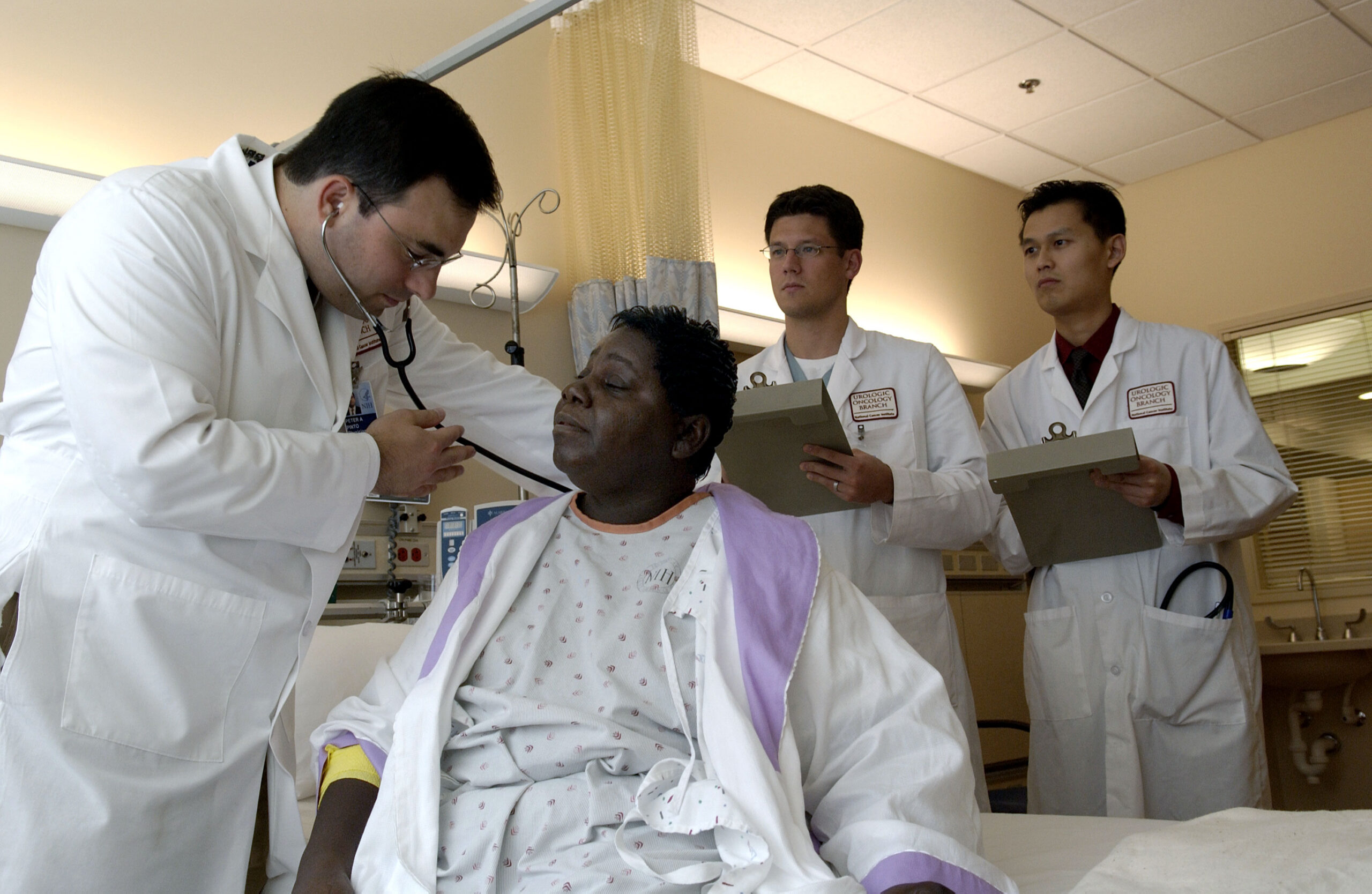 Doctor examines patient with stethoscope - BS/MD programs and elite medical admissions