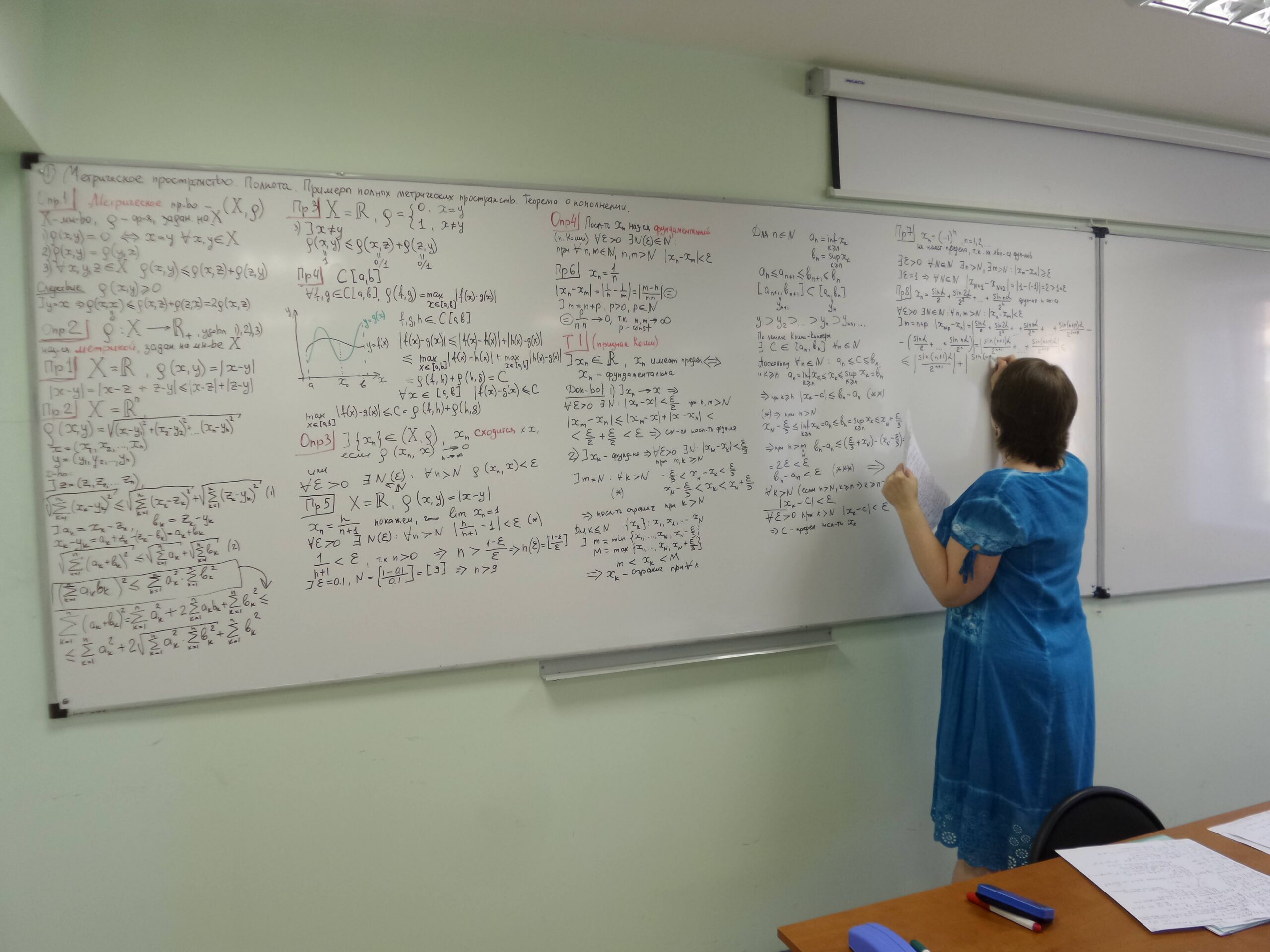 Mathematician writing formulas on a blackboard representing the AMC 12