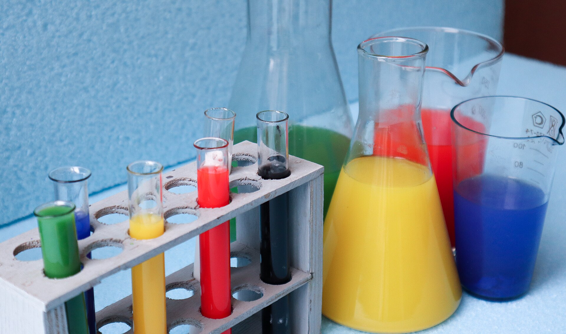 Laboratory glassware holding colored solutions